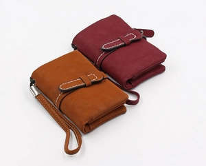 Brown and burgundy faux suede bifold wallets with contrast stitching and wrist straps