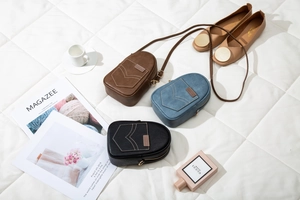 Detailed flat lay of vintage PU leather phone bags in brown, blue and black with top zippers