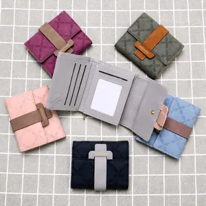 Detailed interior of women's trifold floral wallet showing card slots and ID window