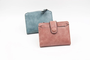 Close-up of matte PU leather women's wallets in pink and blue with premium stitching detail