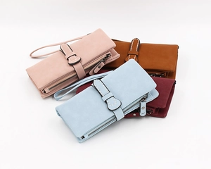 Detail view of multi-color long wallets with matte finish and bow buckle design