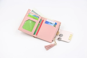 Detail of pink PU leather folding wallet showing card slots and zipper coin pocket