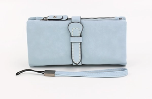 Detailed close-up of light blue matte PU leather wallet with zipper and wrist strap
