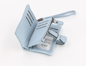 Detail view of light blue wallet interior featuring card slots, ID window and coin pocket