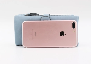 Light blue long matte wallet shown next to a smartphone for size comparison