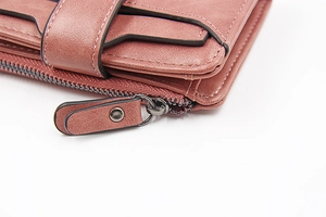 Detailed close-up of pink PU leather wallet showing card slots and zipper stitching