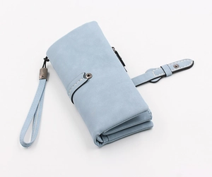 Detail of light blue matte leather long wallet with wristlet and snap button closure