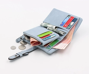 Detailed interior view of a light blue tri-fold wallet showing card slots and coin pocket