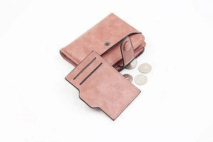 Detailed macro view of pink matte PU leather wallet with card holder and zip coin pocket