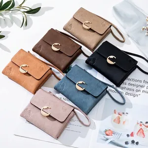 Short faux leather wallet for women with flower embossing and gold C-buckle in six colors