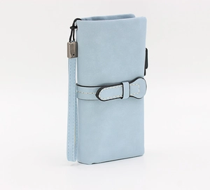 Detail of baby blue long wallet showing white stitching and bow-shaped buckle strap