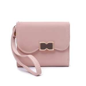 Close-up of pink PU leather folding wallet with gold metal buckle and wristlet strap