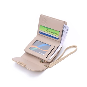 Detailed interior of apricot PU leather wallet showing card slots and wristlet strap