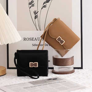 Short PU leather wallets in black and brown with metal buckles and wrist straps