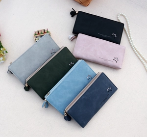 Flat lay of stylish PU leather wallets in six colors with cat embroidery and quotes