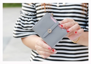 Gray lychee textured short wallet for women with pink interior and zipper pocket