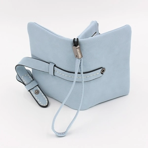 Light blue tri-fold minimalist wallet for women with matte texture and wrist strap