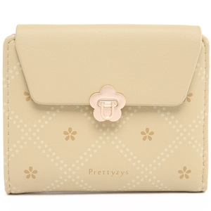 Detailed view of the beige floral cutout and quilted pattern on a women's short wallet
