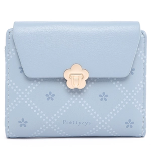 Close-up of light blue wallet with cherry blossom print and gold flower clasp