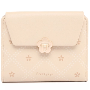 Close-up of quilted floral pattern and metal flower clasp on beige small wallet