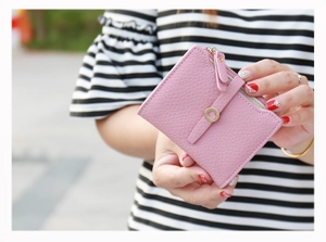 Pink lychee texture short wallet for women featuring a metal ring buckle and zip pocket
