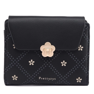 Detail of black cherry blossom floral wallet with golden flower clasp and logo