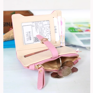Internal view of pink short wallet showing card slots, bill compartment and coin pocket