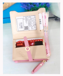 Detailed view of the pink PU leather wallet interior with card slots and a zipper coin pocket