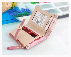 Detail view of pink and beige bifold wallet with card slots and zipper pocket