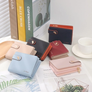 Women's compact bifold leather wallets with gold leaf buckle in multiple soft colors