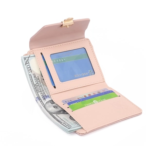 Detail view of pink trifold PU leather wallet featuring card slots and gold clasp