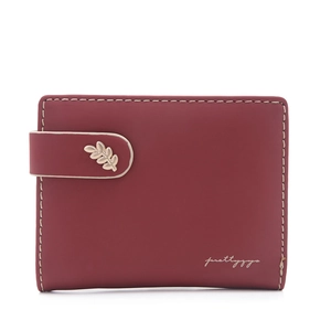 Detail view of burgundy PU leather wallet featuring a golden leaf clasp and fine stitching
