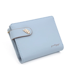 Close-up of light blue short wallet featuring a gold leaf metal buckle and fine texture