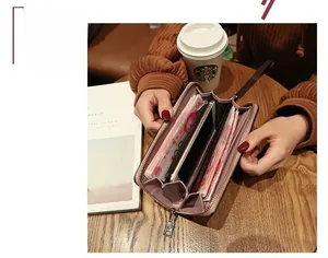 Detailed interior of a mauve long wallet with multiple card slots and phone compartment