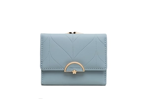 Detail of light blue leather wallet with leaf stitching and golden flower buckle