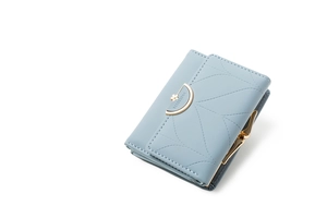 Detail of light blue tri-fold wallet showing radial stitching and gold floral clasp