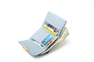 Detailed interior of light blue tri-fold wallet showing multiple card slots and cash pocket