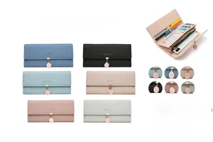 Detail view of long wallets showing interior card slots and leaf pendant zip colors