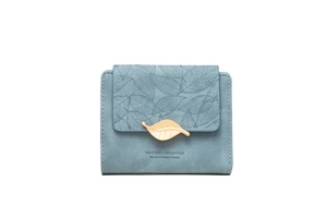 Detailed close-up of light blue small faux suede wallet featuring a gold leaf buckle