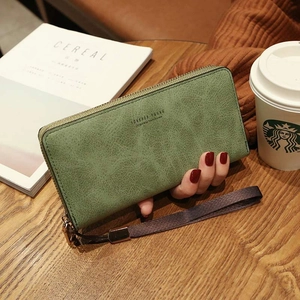 Women's avocado green zipper wallet in pebble grain leather with handy wrist strap