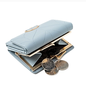 Light blue tri-fold wallet for women with quilted stitching and gold coin compartment