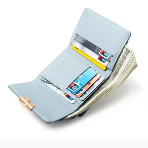 Light blue tri-fold leather wallet for women with card slots and golden ball clasp