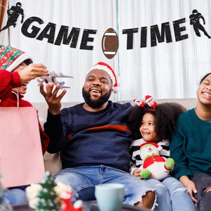 Glittery Game Time banner with football silhouettes for sport theme party decoration