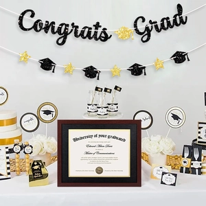 Black and gold graduation party set with Congrats Grad banner and sparkling star bunting