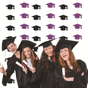 Detail of black and purple graduation cap banner for party wall decorations