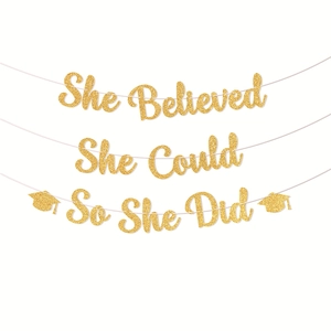 Golden glittery graduation banner with motivational text she believed she could so she did