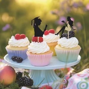 Elegant black female graduate silhouette cake toppers on cream cupcakes for party decor