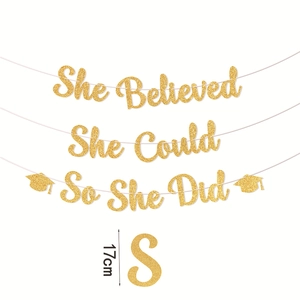 Gold glitter graduation banner She Believed She Could So She Did with graduation caps