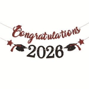 Macro detail of red glitter Congratulations 2026 graduation banner with stars and graduation cap