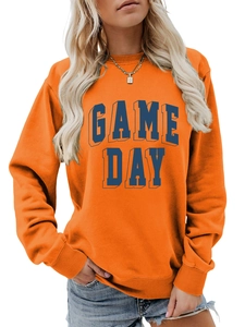 Detail of the Game Day text print and ribbed crew neck on orange long sleeve sweatshirt